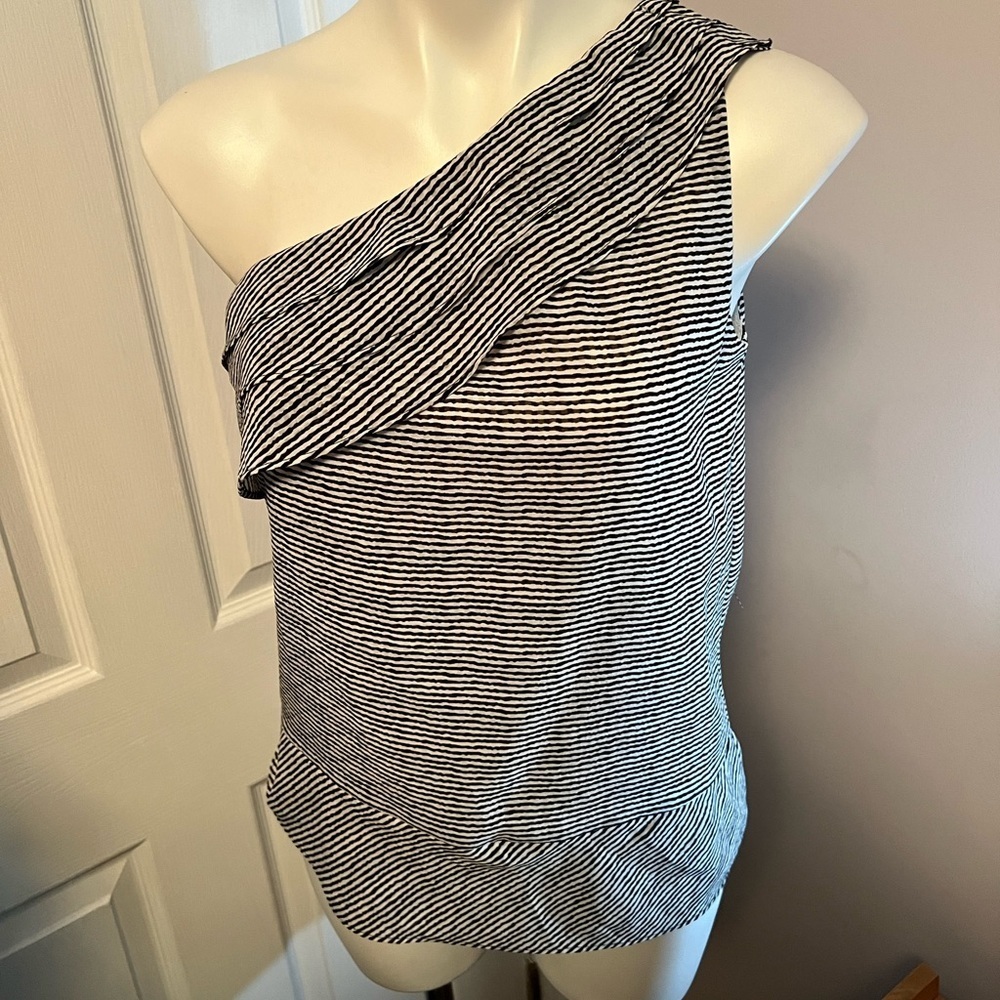 The limited black and white striped off the shoulder going out top